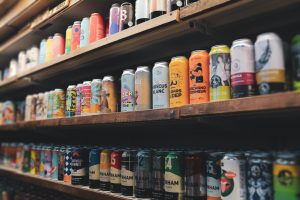 aluminium beer cans on shop shelf